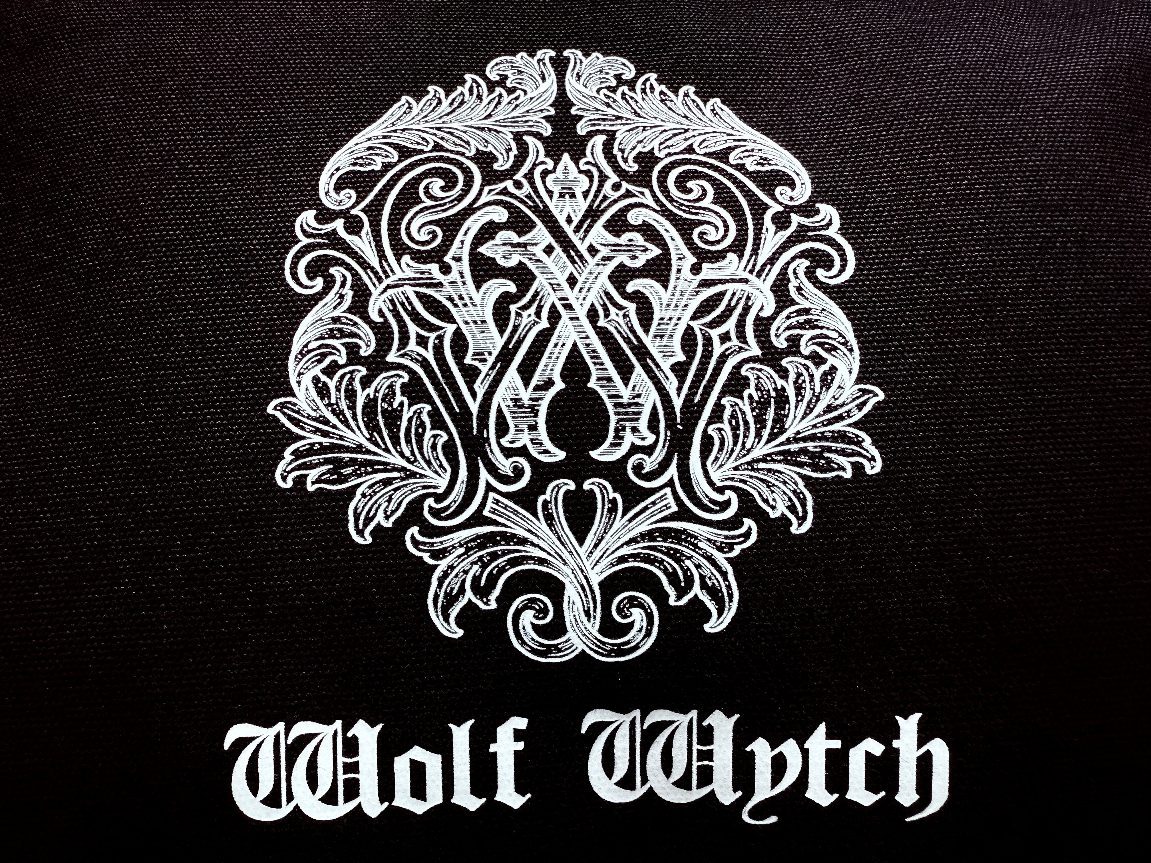 Wolf Wytch Monogram Wristlet Bag